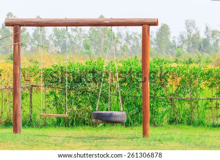 wood swing in the garden nature background