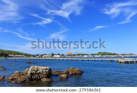 The view of fishing villages and walk way in nature blue sea in sunshine day