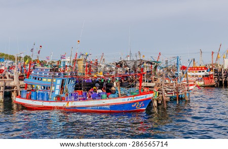 SATTAHEEP CHONBURI - JUNE,12 : The group of fishing boats are mooring at the old port. They are waiting for go out when the wind coming. This is the nice view of fishing villages.THAILAND JUNE,12 2015