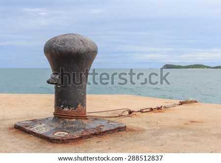 black big mooring stand alone on the port nature background
