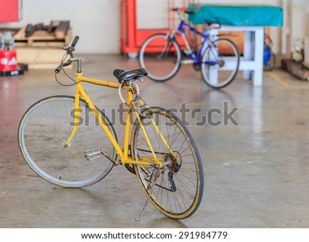 SATTAHIP CHONBURI - JUNE,30 : The yellow bicycle is parked in the office that is the best way for traveling in little town where called \