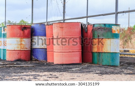 SATTAHIP CHONBURI - AUGUST,8 : The rusty oil barrel set in dirty floor in store of factory in Pattaya. THAILAND AUGUST,8 2015
