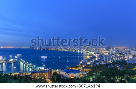 PATTAYA CHONBURI - AUGUST, 18 : The night view of gulf, building and skyscrapers in twilight time . Pattaya city is famous about sea sport and night life entertainment. THAILAND AUGUST,18 2015