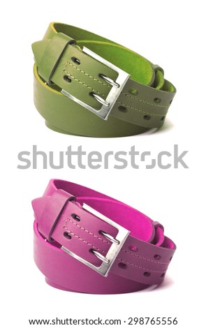 Green and pink leather belts isolated on white background