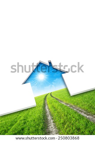 Eco house concept. Cutting of a blank sheet, house shaped above a green field background