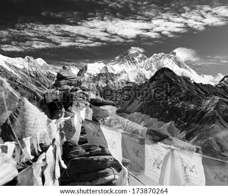 Black and white view of everest from gokyo ri with prayer flags and clouds - Nepal