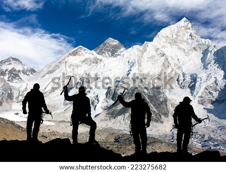 Mount Everest and silhouette of men - trek to everest base camp - Nepal