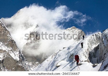 group of climbers on mountains montage to mount Lhotse, Everest area, Khumbu valley, Nepal