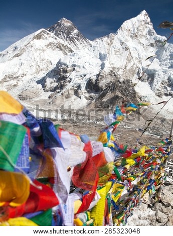 view of Mount Everest with buddhist prayer flags from Kala Patthar, way to Everest base camp, Nepal