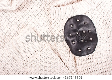 White soft woolen sweater. Fashion texture