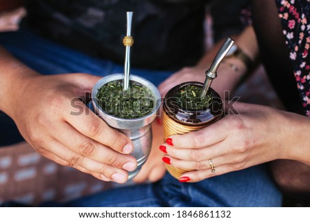 Yerba mate tea in bombilla. Special metal straw. Sout America popular hot drink. Couple drinking healthy herbal beverage. Engagement outdoor picnic. Photo stock © 
