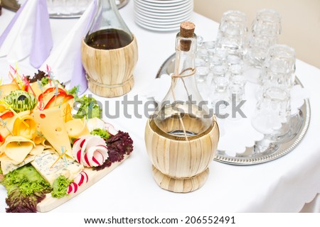 Village elegant table with cheese and vodka. Polish european culture.