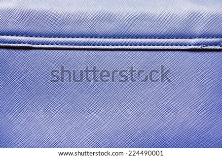 Blue artificial leather bag texture.