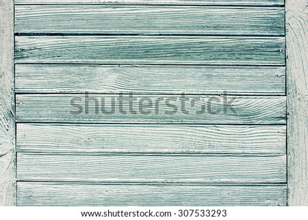 Wooden desks covered with green peeling paint texture