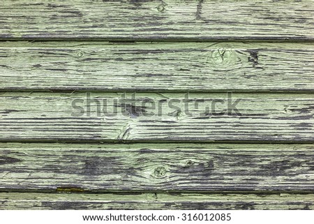 Green painted wooden desks texture.