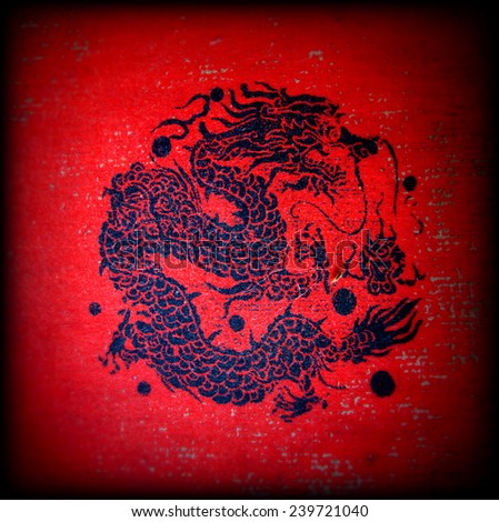 Black dragon on the red background