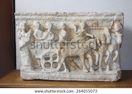 VERONA, ITALY - MARCH 18: An Etruscan cinerary urn in Museo Lapidario Maffeiano at Piazza Bra on March 18, 2015 in Verona. A voyage on a covered carriage pulled by mules, 2nd century B.C.