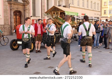 INNSBRUCK, AUSTRIA - APRIL 24: Men are dancing in traditional Austrian leather breeches (Lederhosen) for \