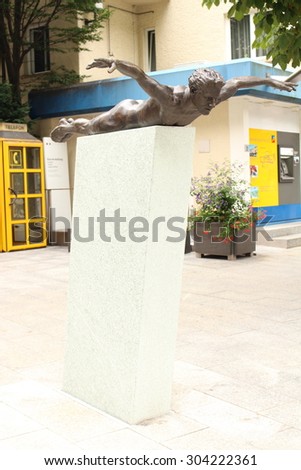 VADUZ, LIECHTENSTEIN - AUGUST 4: Bronze flying man sculpture 