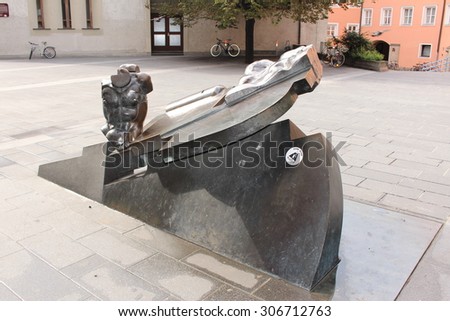 INNSBRUCK, AUSTRIA - AUGUST 15: An abstract human body sculpture in the yard of Innsbruck Music School near Marktgraben street on August 15, 2015 in Innsbruck.