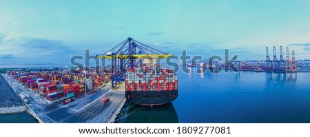 Rear view cargo container ship. Business logistic transportation sea freight, Cargo ship, Cargo container in deep sea port at industrial estate for import export around in the world Сток-фото © 