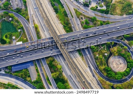 Similar – Image, Stock Photo Road with rails in the night and car headlights in the background