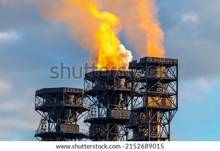 Similar – Image, Stock Photo Gas flaring at oil refinery in evening