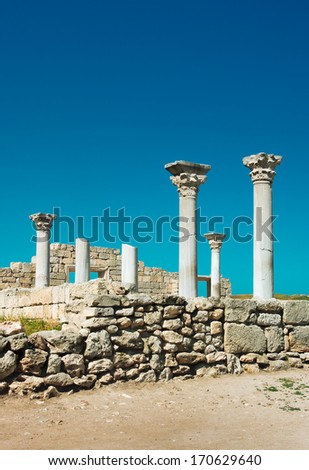 Ancient architecture with marble columns. Archeology landmark of European civilization. Antique ruins with pillars of the Byzantine temple.