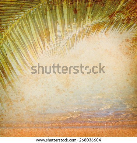 Vintage background with palm leaves. Grange texture for exotic travel in retro style. Tropical jungle on the old grunge antique paper - concept of adventure on the tropical island.