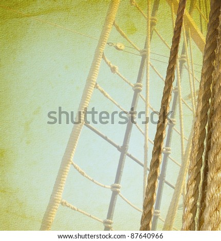 Nautical ropes and ladder. Vintage background with sea hemp ropes on the old ship. Ladder upstairs on the mast.
