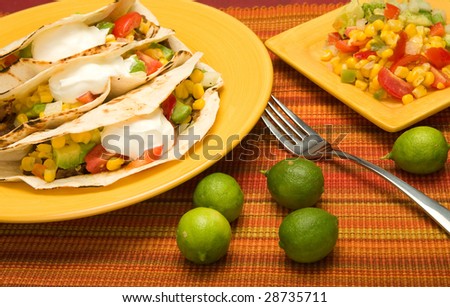 Beef Folded Tortilla Tacos with corn, tomato, avocado,onion, and pepper salsa