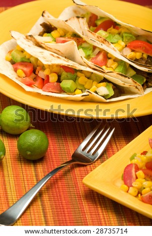 Beef Folded Tortilla Tacos with corn, tomato, avocado,onion, and pepper salsa