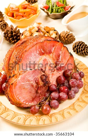 Glazed Spiral Sliced Ham garnished with red globe grapes