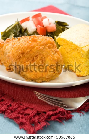 Fried Chicken served with collard greens and cornbread
