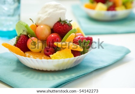 Fruit salad with cherry, strawberry, raspberry, pineapple, mango and kiwi