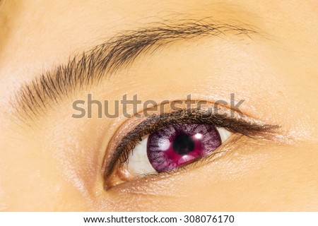 Eyelashes extension and both purple colored contact lenses eyes
