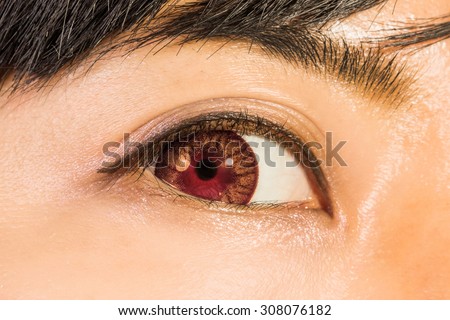 Eyelashes extension and red colored contact lenses Asian