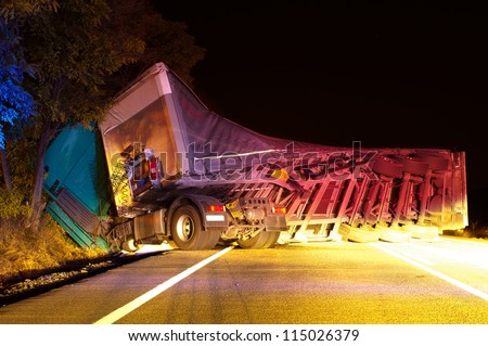 Overturned truck in crash. Night Photo