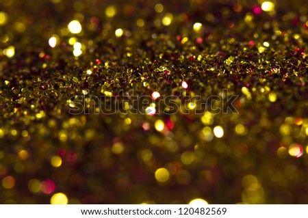 Holiday yellow shiny background. Blurry lights in yellow red colors