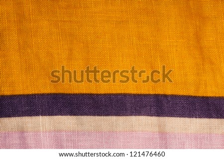 Stamped multicolored lines fabric. Natural linen fabric.Pink, orange and violet colors