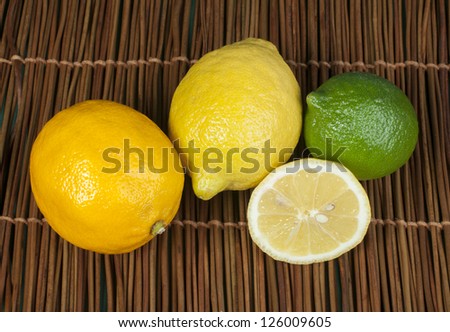 Three varieties of lemons. Yellow lemon, lime and orange lemon