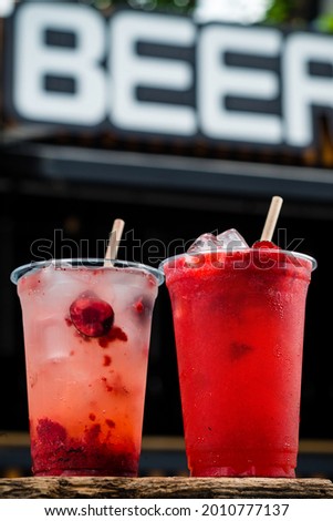 Similar – Image, Stock Photo two plastic cups with liquor stand on a wooden table