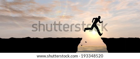 Concept or conceptual young man or businessman silhouette jump happy from cliff over water gap sunset or sunrise sky background banner