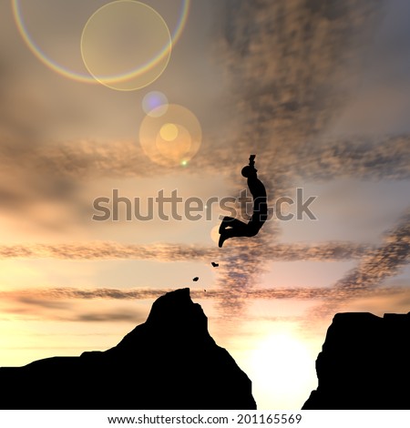 Concept or conceptual young man or businessman silhouette jump happy from cliff over  gap sunset or sunrise sky background