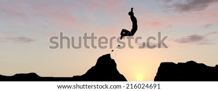 Concept or conceptual young man or businessman silhouette jump happy from cliff over  gap sunset or sunrise sky background as metaphor to freedom, nature, mountain, success, free, joy, health or risk