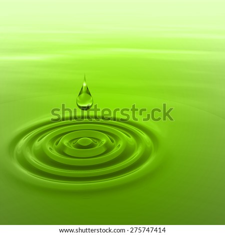 Concept or conceptual green liquid drop falling in water with ripples and waves background
