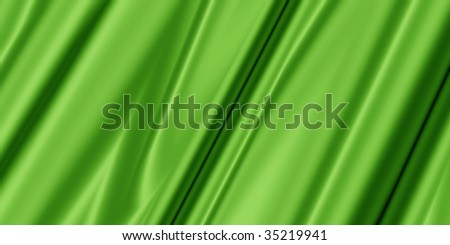 green abstract background with soft silk or textile for fashion,texture,industry or clothing designs
