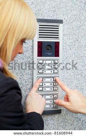 Video intercom in the entry of a house and stranger guest, technology and security background