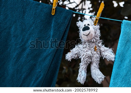 Similar – Image, Stock Photo Towels on clothesline between two trees on the campsite. In the background a caravan with awning.