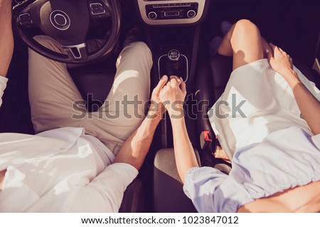 Similar – Image, Stock Photo Woman sitting on driver seat and putting on gloves